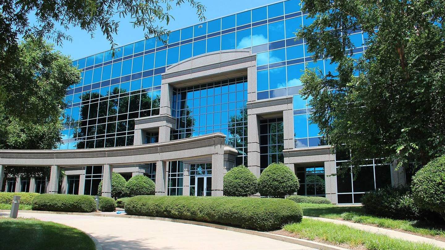 The glass-fronted office building that houses Johns Creek City Hall