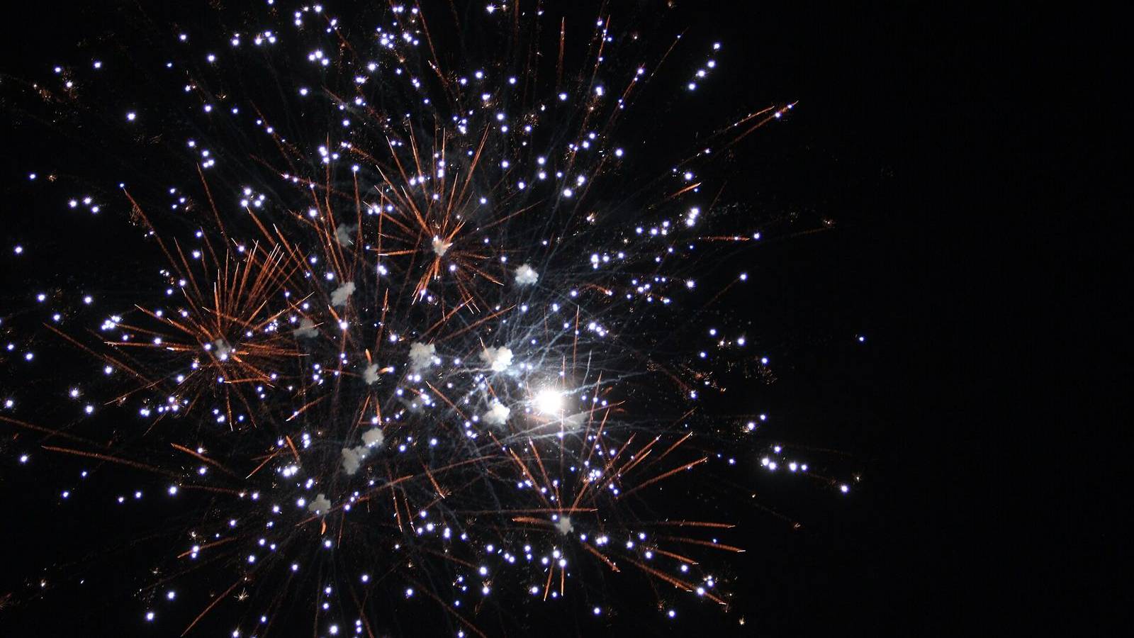 Fireworks bursting in the night sky over Newtown Park in Johns Creek