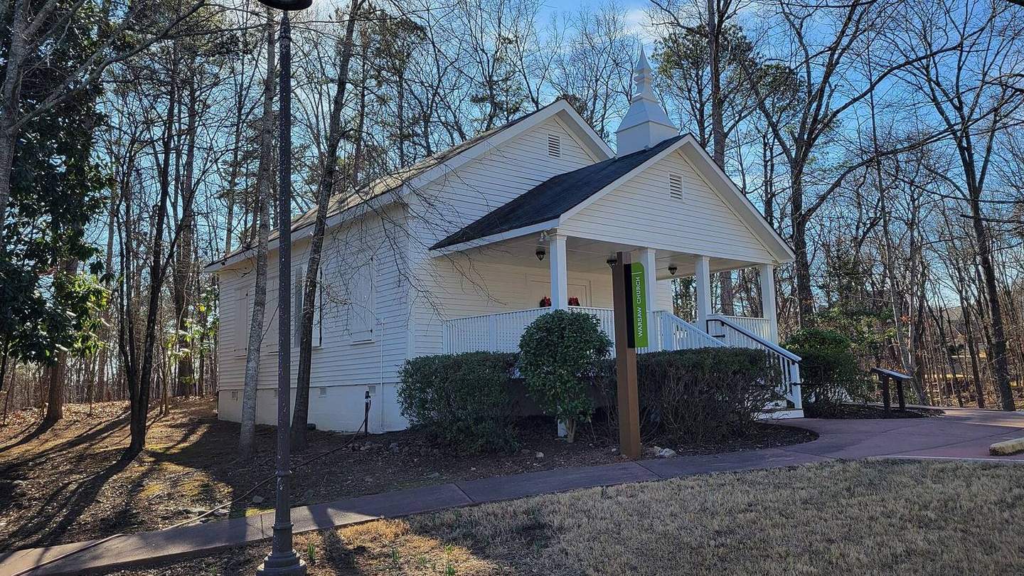 The small white Warsaw Church building at Autrey Mill Nature Preserve in Johns Creek
