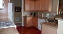 Kitchen with Silestone Counter Tops and Tile Backsplash