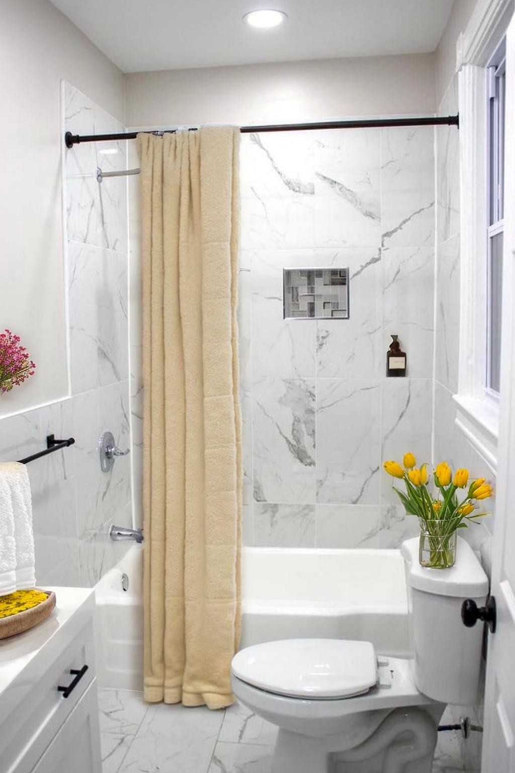 Elegant marble bath with fresh blooms.