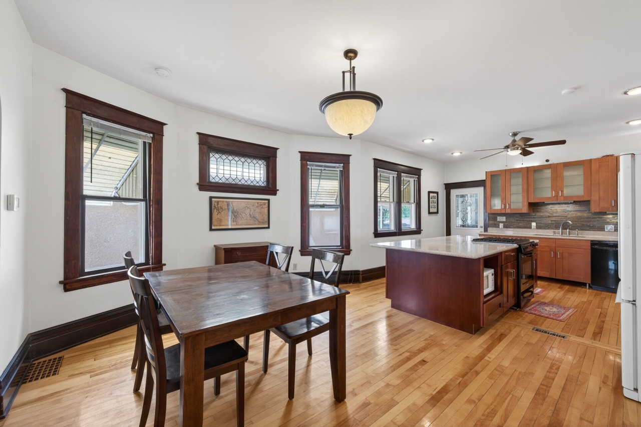 Remodeled kitchen with stone-counter island, upper unit 620 Van Buren St NE Minneapolis