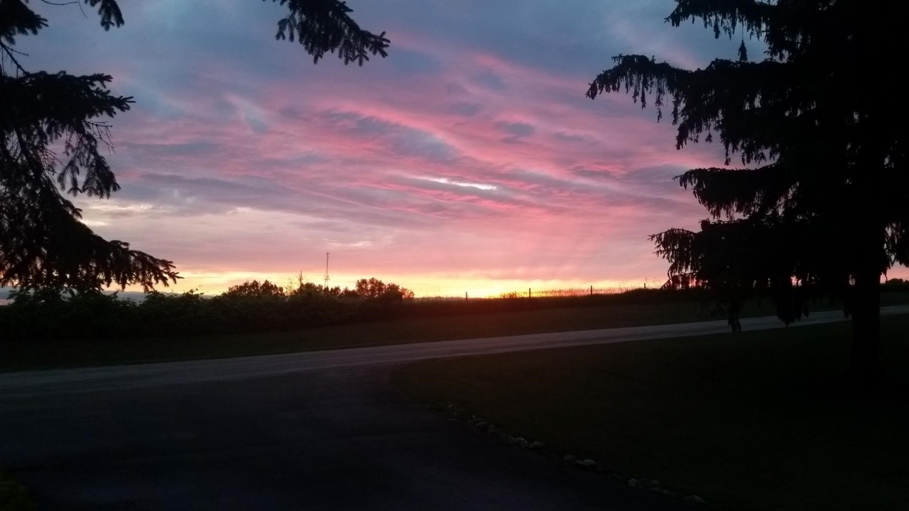 Beautiful Sunsets Overlooking Farm Field
